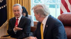 China's Vice Premier Liu He (L) speaks with US President Donald Trump during a trade meeting in the Oval Office at the White House in Washington in April 2019