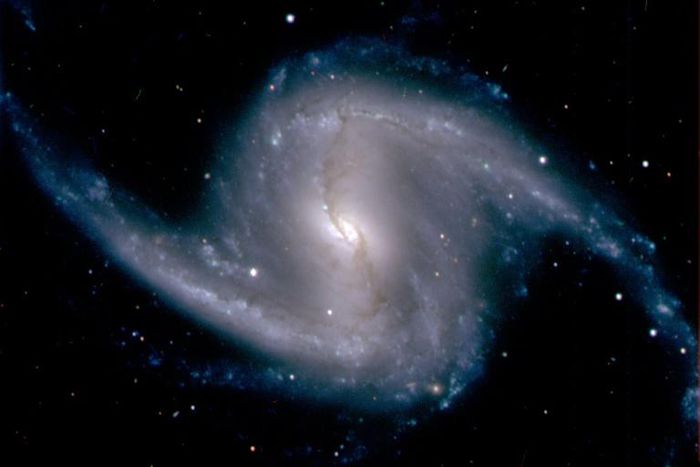 Spiral galaxy NGC 1365 observed from Chile in 2012 -- a new method gauges how to measure the universe's accelerating growth