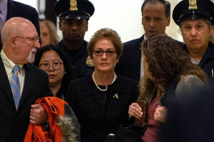 Former US ambassador to Ukraine Marie Yovanovitch (C) arrives for a closed-doors deposition before House committees leading the impeachment investigation of President Donald Trump, on October 11, 2019