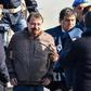 Italian former communist militant Cesare Battisti (C) has admitted all the charges brought against him "in four murder cases" carried out in the 1970s
