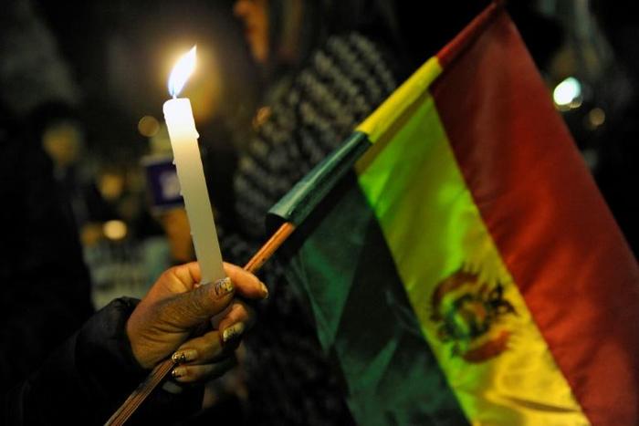 Vigils in Bolivia commemorate the victims of clashes between opposing groups in the country's disputed election