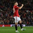 Manchester United midfielder Daniel James celebrates scoring the winning penalty against Rochdale