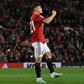 Manchester United midfielder Daniel James celebrates scoring the winning penalty against Rochdale