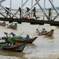 People from Dala township arrive in Yangon by boat after crossing the river