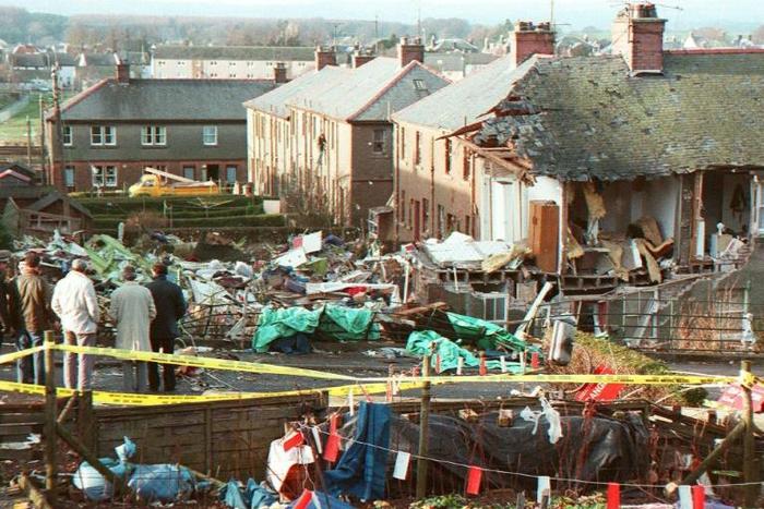 In this file photo taken on December 22, 1988, residents look at the damages caused by the explosion of the 747 Pan Am Boeing airliner that crashed over Lockerbie, Scotland, killing 270 people, including 11 on the ground.