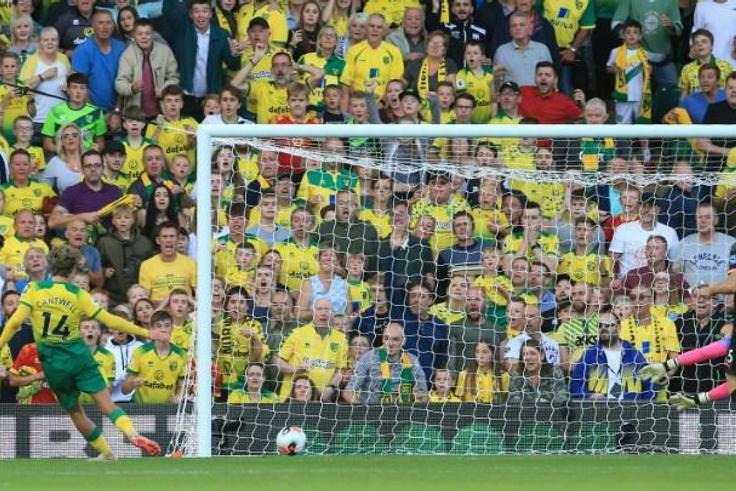 Todd Cantwell (left) scores Norwich's second goal in a thrilling 3-2 win over Manchester City