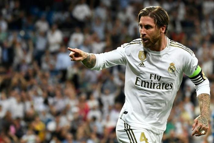 Real Madrid's Spanish defender Sergio Ramos celebrates after scoring a goal during theChampions league Group A 2-2 fdraw with Club Brugge