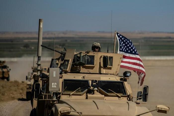 A US military vehicle near the Syrian border with Turkey in early September. President Donald Trump has ordered the nearly 1,000 US trooops in Northeastern Syria to leave the country.