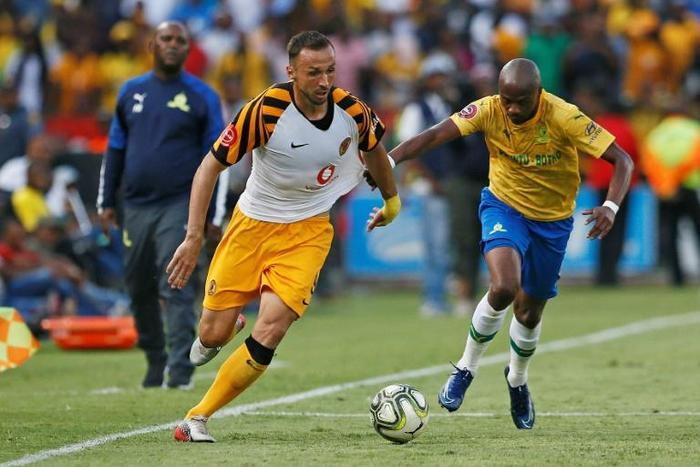 Kaizer Chiefs two-goal star Samir Nurkovic (L) is pursued by Tebogo Langerman of Mamelodi Sundowns during a South African Premiership match in Pretoria Sunday