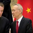 In this file photo taken on February 15, 2019, US Trade Representative Robert Lighthizer (L) listens as Chinese Vice Premier Liu He talks while they line up for a group photo at the Diaoyutai State Guesthouse in Beijing