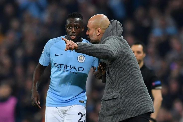 Manchester City manager Pep Guardiola gestures to Benjamin Mendy