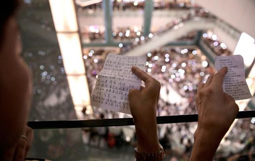 Protesters have gathered at Hong Kong malls to sing a new anthem penned by an anonymous composer