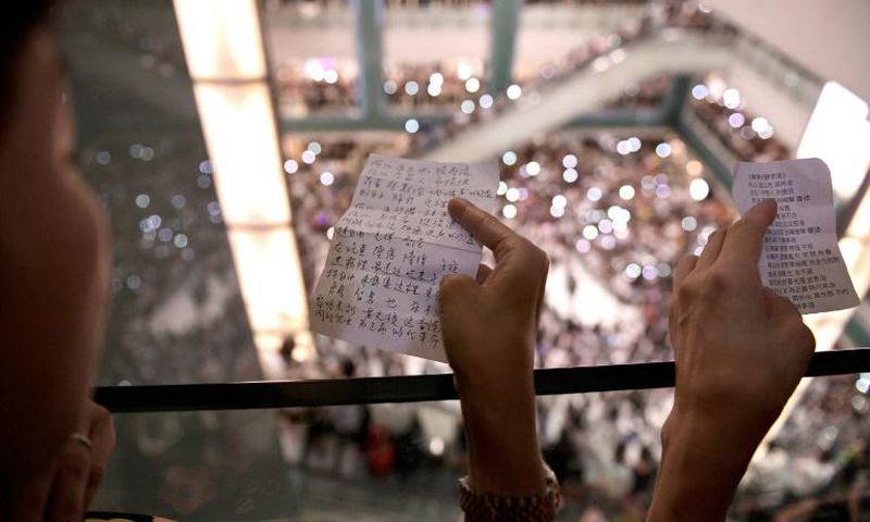 Protesters have gathered at Hong Kong malls to sing a new anthem penned by an anonymous composer