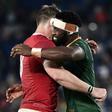 Captain Siya Kolisi (R) hugs teammate Duane Vermeulen, wearing a Wales shirt, after a 19-16 World Cup semi-final victory last Sunday
