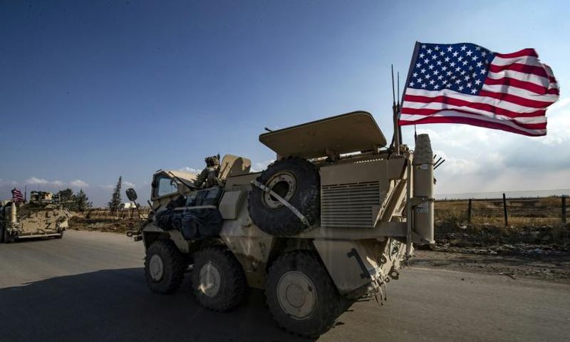 A convoy of US troops is pictured outside the Kurdish-majority city of Qamishli, in Syria's northeastern Hasakeh province on November 2, 2019