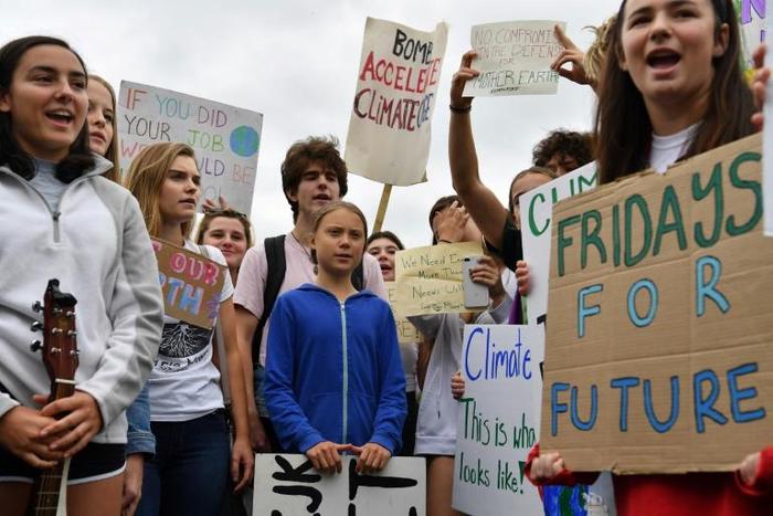 Swedish climate activist Greta Thunberg (C), 16, has inspired a worldwide youth movement demanding governments take action on climate change