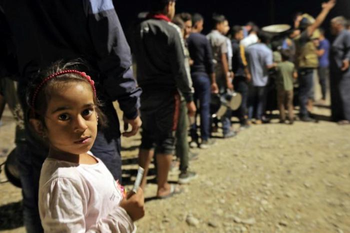 Aid groups say the number of Syrian Kurds seeking refuge in neighbouring Iraq could climb as high as 50,000