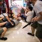 A Beijing supporter fights with an anti-government protester inside a shopping mall in Kowloon Bay.The Hong Kong protests have increasingly pitted ordinary people against each other