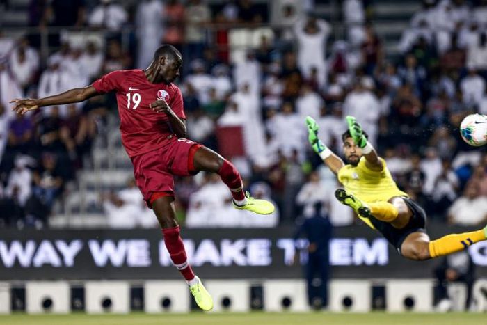 Qatar's forward Almoez Ali (L), the top scorer in the 2019 Asian Cup, struck with a powerful header in the fourth minute and then applied the finishing touch to a fine string of passes in the 11th