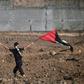 The Palestinian Authority will receive a transfer of 1.5 billion shekels ($430 million) from Israel, officials from the two governments said Friday, in a step towards resolving a months-long standoff; a young protester waves a Palestinian flag on Octob...