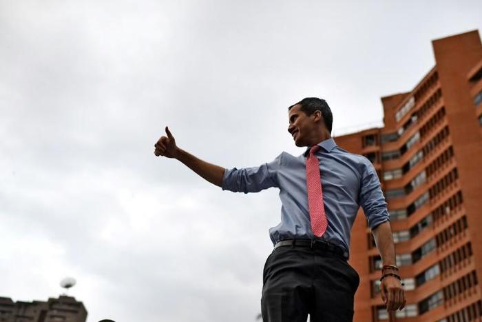 Juan Guaido, pictured here during a massive blackout, has embarked on a tour to rally support to oust President Nicolas Maduro