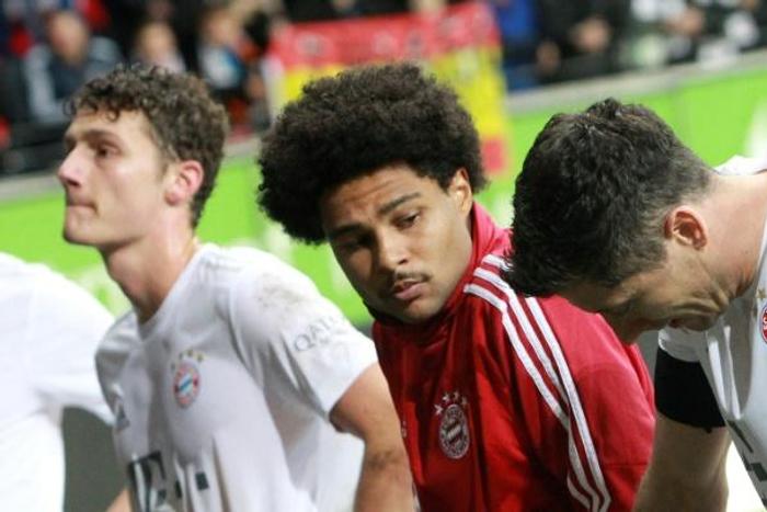 Bayern Munich defender Benjamin Pavard (L), winger Serge Gnabry (C) and Polish forward Robert Lewandowski (R) show their frustration after being thrashed 5-1 at Eintracht Frankfurt on Saturday.