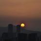 The sun sets in Caracas during a partial power cut on March 25, 2019