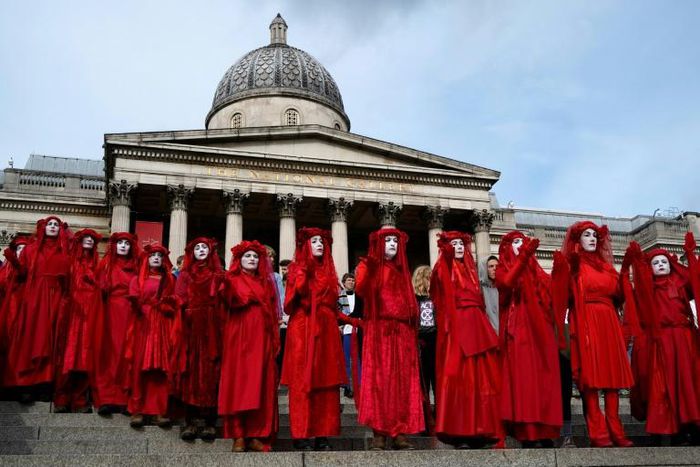 Extinction rebellion activists -- seen on the steps of the National Gallery in London's Trafalgar Square -- said hundreds of their number would occupy London City Airport from Thursday morning until Saturday night