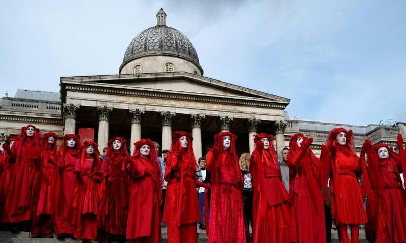 Extinction rebellion activists -- seen on the steps of the National Gallery in London's Trafalgar Square -- said hundreds of their number would occupy London City Airport from Thursday morning until Saturday night