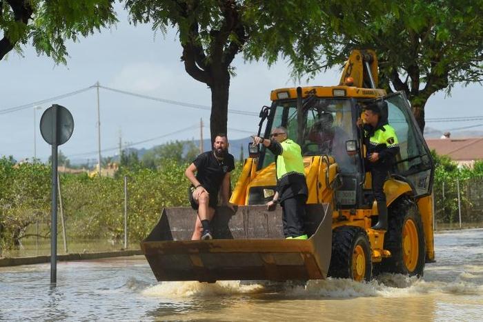 In flooded Redovan, some 50km (30 miles) southwest of Alicante, some people were being evacuated with diggers