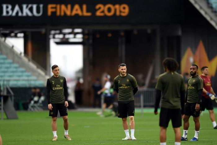A second man has pleaded guilty to attempting to rob Arsenal stars Mesut Ozil (left) and Sead Kolasinac (centre)