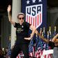 US women's soccer star Megan Rapinoe, left, and her teammates won a court ruling Friday in their fight for equal pay from the US Soccer Federation