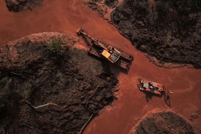 Aerial view showing emergency crews using an amphibious vehicle and heavy machinery to pick through mud looking for bodies, 99 days after the collapse of the Corrego do Feijao dam of mining company Vale in Brumadinho, Minas Gerais State, Brazil, on May...