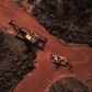 Aerial view showing emergency crews using an amphibious vehicle and heavy machinery to pick through mud looking for bodies, 99 days after the collapse of the Corrego do Feijao dam of mining company Vale in Brumadinho, Minas Gerais State, Brazil, on May...