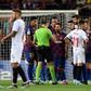 Referee Mateu Lahoz, who sent off Ronald Araujo, No. 33, received advice from Lionel Messi and Luis Suarez as well as several Sevilla players