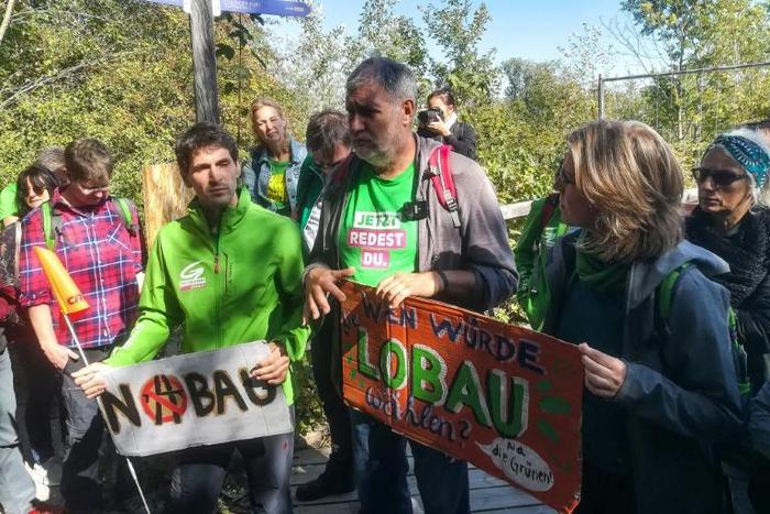 Austrian environmentalist candidate Lukas Hammer (2nd L) has dismissed the idea of a highway under a national park as a 'solution of the past'