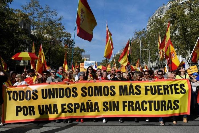 Demonstrators waving Spanish and Catalan flags brandished a banner reading "together we are stronger -- for a Spain without fractures"