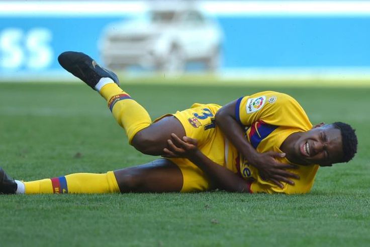 Guinea-Bissau teenager Ansu Fati falls with a shoulder injury while playing for Barcelona against Osasuna at the weekend