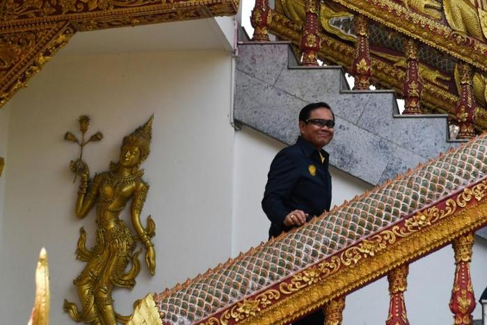 Thailand's Prime Minister Prayut Chan-O-Cha arrives at Wat Bupparam temple in Chiang Mai Tuesday to oversee a Buddhist ceremony. Prayut is expected to be named premier when final results of last month's election are released