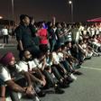 Indian fans who could not get tickets watch on a giant screen outside the stadium where Qatar play India in a World Cup tie