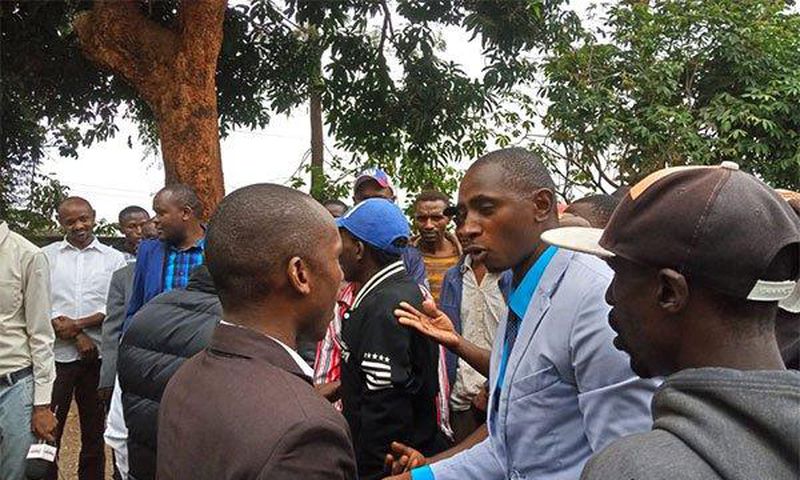 Two Kenyan MPs from the same party exchange serious blows in church over microphone (Video)
