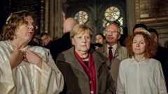 German Chancellor Angela Merkel met rabbi Gesa Ederberg (l) and other members of the Jewish community at a vigil outside the New Synagogue in Berlin