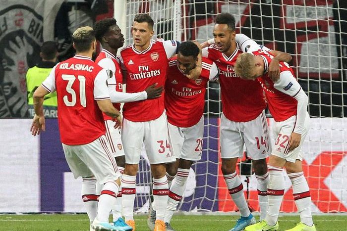 Arsenal's players celebrate after English midfielder Joe Willock (centre) scored the opening goal at Eintracht Frankfurt on Thursday in the Europa League