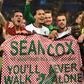 Liverpool players hold a tribute to fan Sean Cox