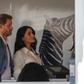 Helping hand: Prince Harry and his wife Meghan, the Duchess of Sussex, at a youth employment hub in Johannesburg