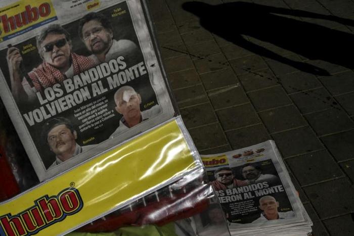 The front page of a Medellin newspaper from August 30, 2019 shows the faces of four former FARC members after they announced their return to arms