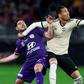 Manchester United's Chris Smalling (R) fights for the ball with Perth Glory's Bruno Fornaroli (L) during a pre-season friendly in Perth on July 13, 2019.
