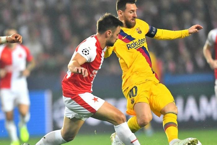 Lionel Messi gets past Slavia's David Hovorka