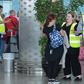 British officials talk to tourists booked with Thomas Cook as they wait for repatriation flights from Enfidha airport on the outskirts of the Tunisian coastal resort of Sousse
