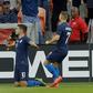 Christian Pulisic #10 of the USA celebrates with teammate Paul Arriola after scoring in the first half of a 1-1 friendly draw with Chile in Houston